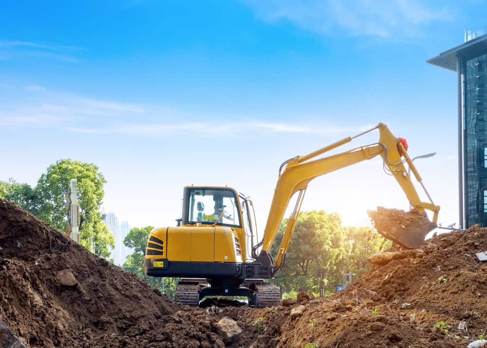 Excavators,Excavate,Earth,At,The,Construction,Site